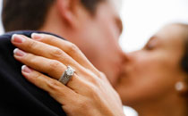 Kiss of Bride and Groom with Wedding Ring
